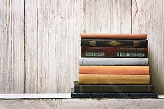 Book shelf blank spines, empty binding stack on wood texture