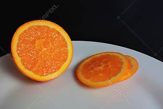 Sliced ??orange on a white plate