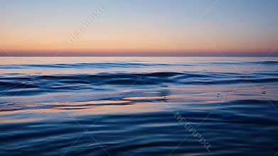 Calm Sunset Over Expansive Ocean Horizon with Gentle Rolling Waves