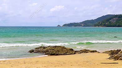 Amazing beach with rocks waves turquoise water in Patong Thailand