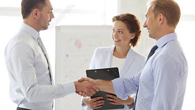 Two businessmen shaking their hands