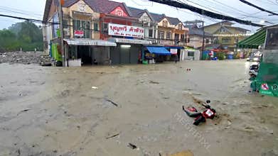 Extreme rainfalls monsoon rain flooding streets typhoon in Phuket Thailand