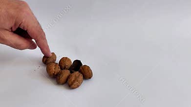 Organic Walnuts Arranged on White- Simple, Clean Food Composition