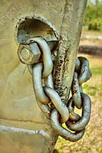 The front part of a boat with the mooring chain