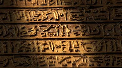 Light spot moving on egypt hieroglyphics