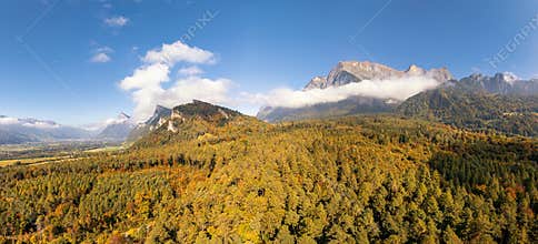 panorama landscape view of mountain and forest landscape in autumn near Maienfeld in the Swiss Alps