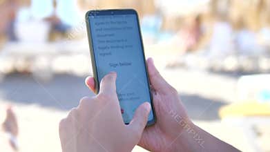 A professional executes a digital signature directly on a smartphone screen using his finger, completing an electronic