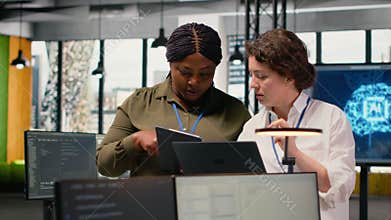 Programmers in office automating workflows using artificial intelligence tech
