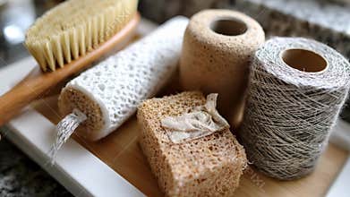 Closeup of ecopackaged cleaning supplies in cellulose wraps showcasing natural materials designed to minimize