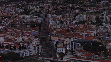 Aerial evening view of Funchal terraces, bridges, and traffic