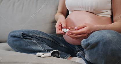 Pregnant Woman Using Fetal Doppler
