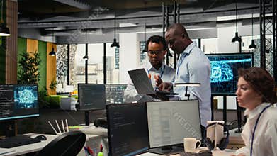 Programmers in office doing software development, brainstorming