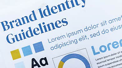 Close up of a Brand Identity Guidelines Document Showing Professional Design Standards Typography Color Palettes and Corporate