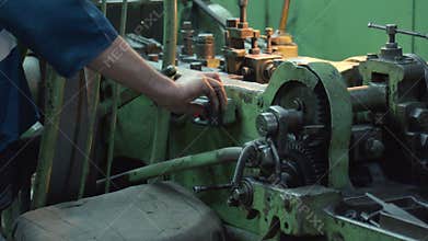Skilled Professional Performs Detailed Calibration On Retro Industrial Lathe With Aged Components. Media