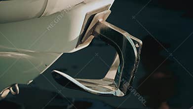 A chrome boat anchor with smooth curves,