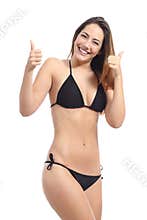 Beautiful sunbather woman wearing bikini gesturing thumbs up