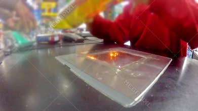 Shopper paying for products at checkout