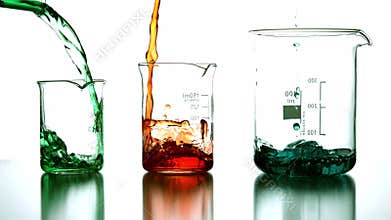 Chemical liquids pouring into beaker