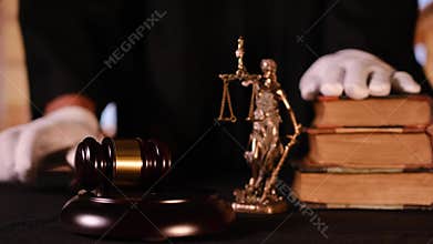 Judge in robe striking gavel in courtroom