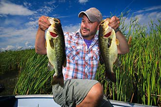 Man Fishing Large Mouth Bass