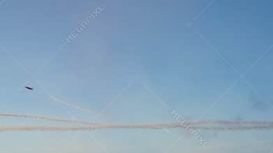 Aerobatic Jets with Smoke Trails in Sky