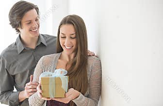 Man Giving Birthday Gift To Woman