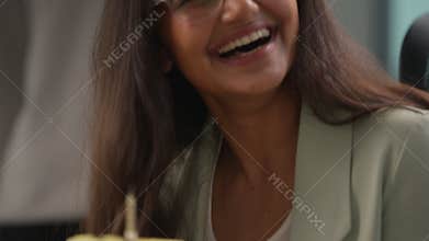 Laughing carefree Hindu business woman girl in office happy holding birthday cake with candle enjoy celebration