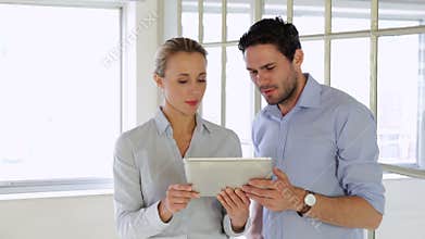 Content colleagues working together with tablet
