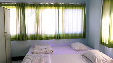 Simple white clean hotel apartment room in Khon Kaen Thailand