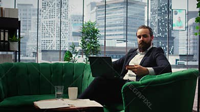 Responsible businessman verifies payment details on his laptop