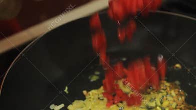 Saute red pepper and garlic slices. saute in a pan