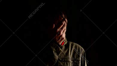 Sad man covering face with hands and crying in despair. Chronic depression, grief, sorrow, sadness, melancholy, moaning concept.
