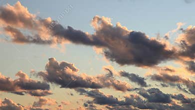 Clouds at sunset float on the sky