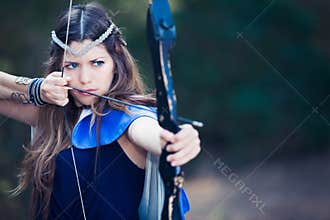 Forest hunter girl with bow and arrow