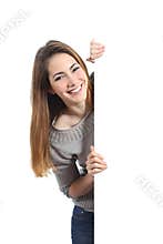 Smiling woman presenting and holding a blank sign