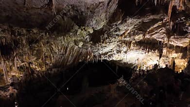 Impressive stalactite and stalagmite formations inside the caves of Postojna, Slovenia.