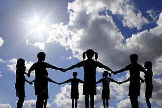 Children circle on real sunny sky