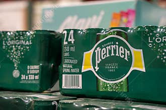 Close up of Perrier carbonated spring water pack in a warehouse.