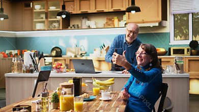 Aged wife takes photos of her with the smartphone camera