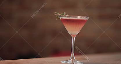 Barman prepares a cocktail with skillful movements