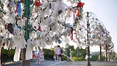 Metal wishing tree covered with wedding ribbons and love locks in Moscow