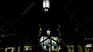 The bridge with walking people near the biggest musical fountain in Dubai, UAE