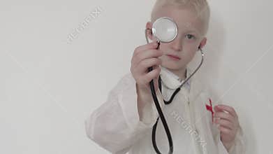 Closeup of a boy in a doctor`s suit