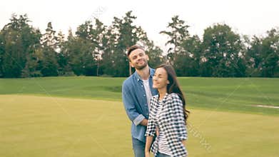 Happy couple says goodbye to the viewer.