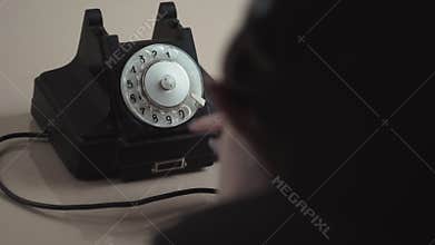 Young Woman Dial On Old Rotary Telephone