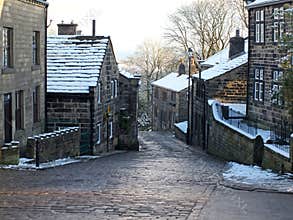The yorkshire village of heptonstall in winter with snow covered roofs and street