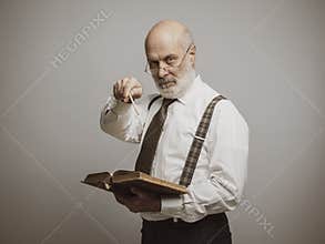 Senior academic professor pointing at camera