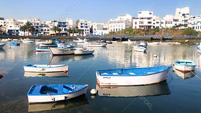 The lagoon of Charco de San Gines in Arrecife with a flotilla of small boats on a sunny afternoon, Lanzarote, Canary Islands,