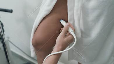 Doctor makes ultrasound of veins on patient`s legs, close up, steadicam shot.