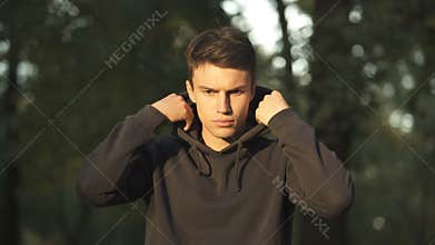 Blind man taking off hood, panhandling to ask for support and charity, disable